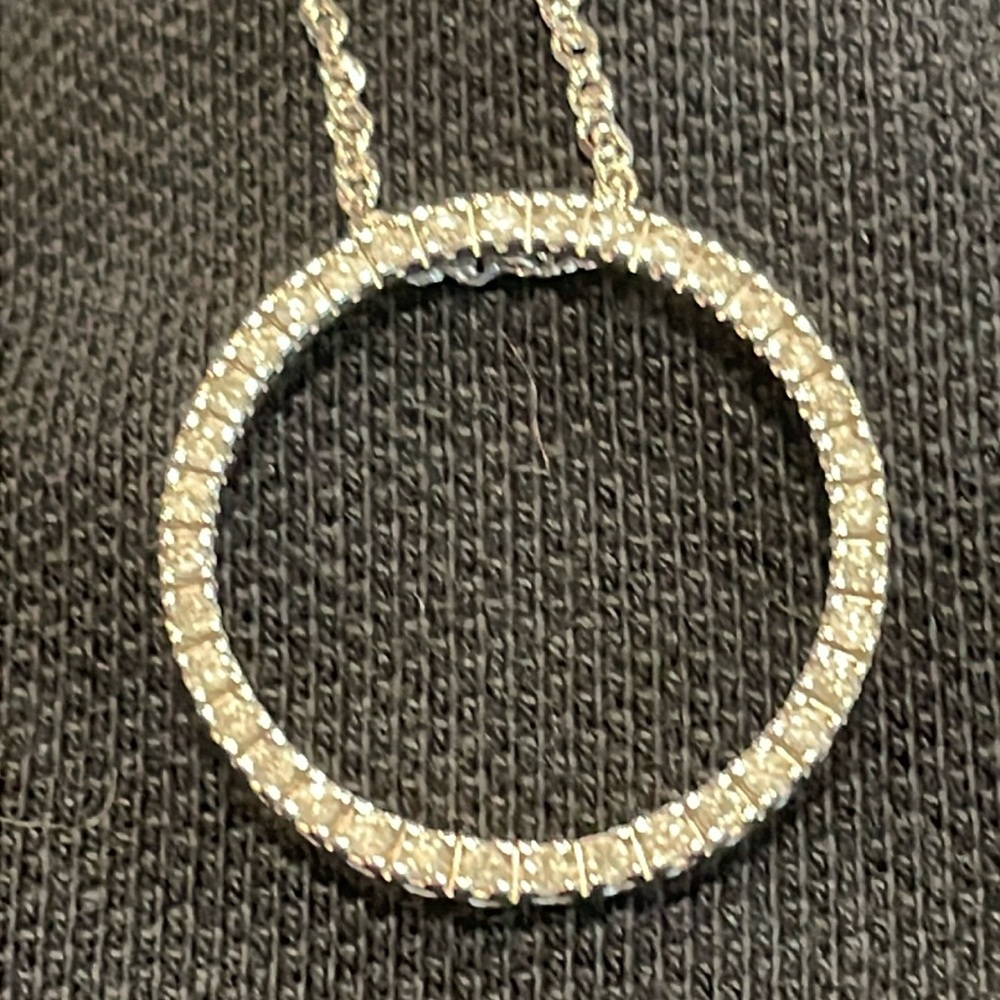 Women’s silver necklace with a circle diamond charm